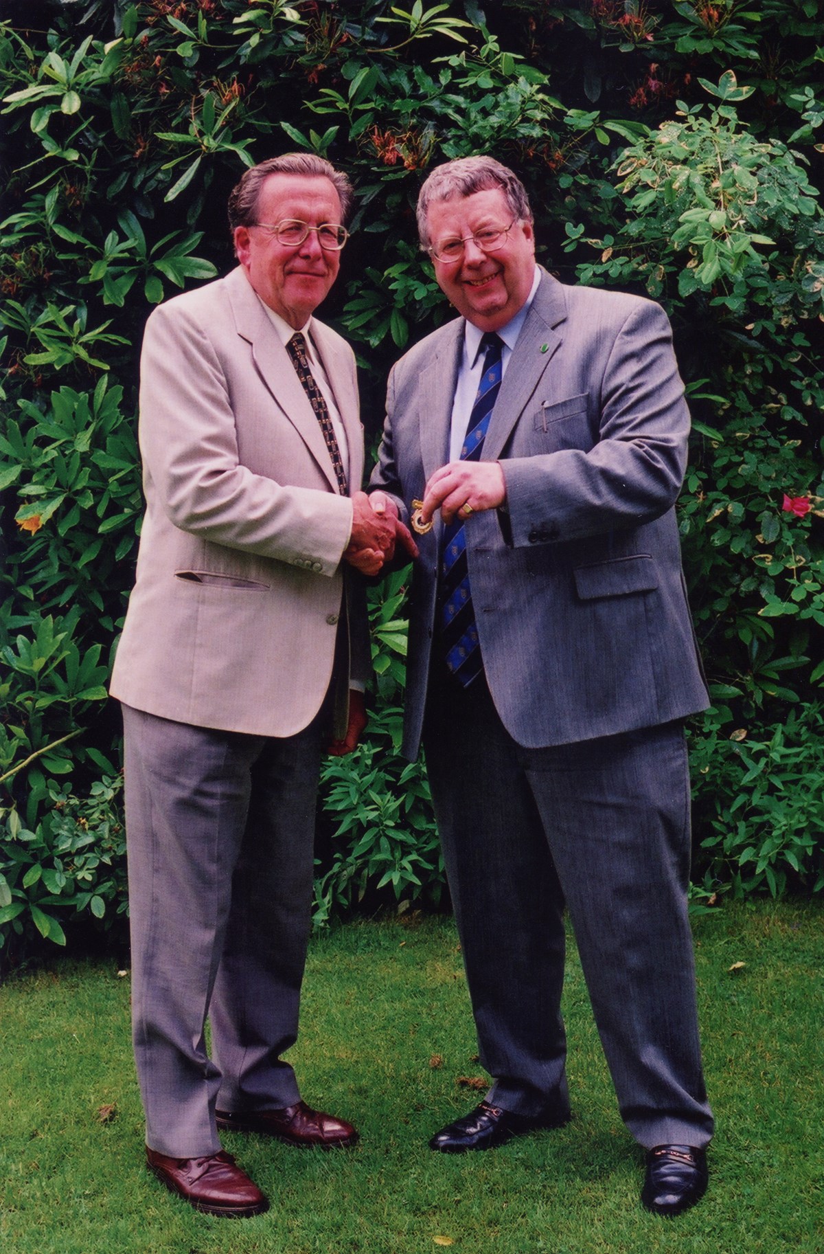 2000. ETTA AGM. Colin Hyland receiving his Vice-President's badge from Chairman, Alan Ransome.
